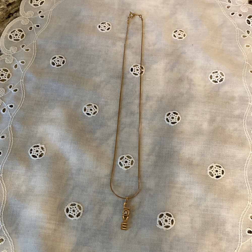 Avon gold tone necklace with Love pendant